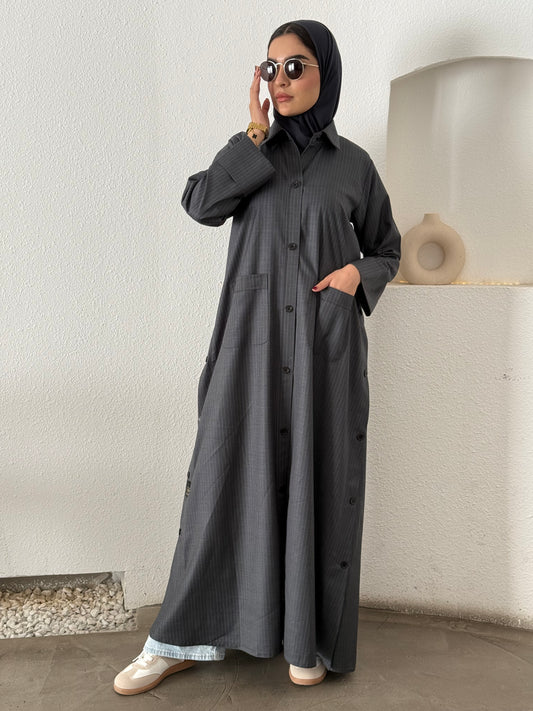 A dark grey pinstripe abaya, a linen fabric, perfect for office wear and weekend outings.