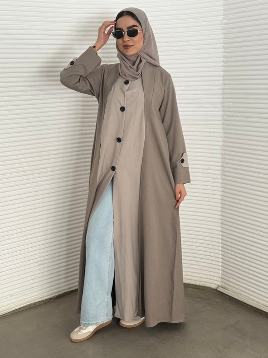 A Light brown & Beige two-tone coat-style abaya, a premium linen abaya, perfect for travel and office wear.
