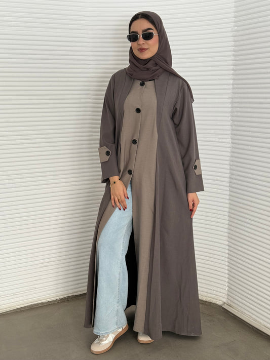A taupe and beige two-tone coat-style abaya, a premium linen abaya, perfect for travel and office wear.