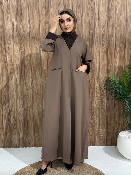 A layered mocha brown abaya of a linen fabric hat is perfectly suited for daytime meetings or casual outings and travel.
