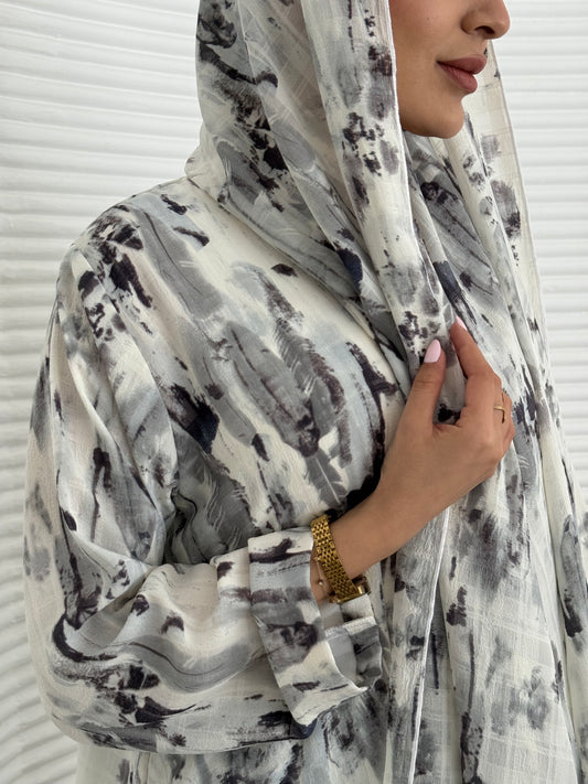 A grey printed satin abaya, an elegant abaya that is perfect for summer, daytime events, artistic gatherings.