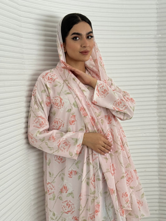 A soft pink floral chiffon abaya, an elegant abaya that is perfect for summer, daytime events, and brunch.
