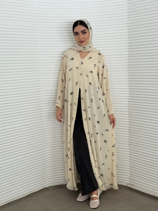 A cream minimal floral chiffon abaya, an elegant abaya that is perfect for summer, daytime events, and brunch.