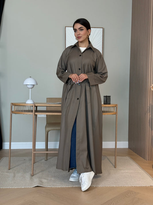 An oud brown linen abaya with smart collar and practical pockets, a perfect choice for office wear and everyday wear.