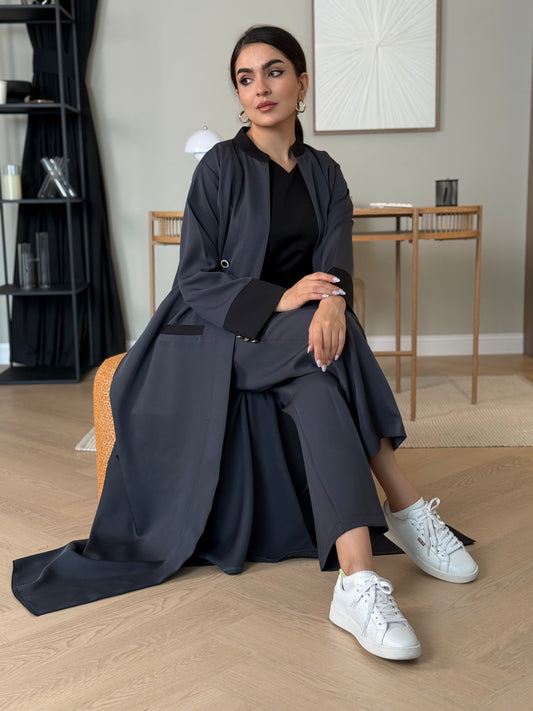 A dark grey 3-piece abaya set that includes an open abaya, matching trouser, inner top and sheila. This abaya is perfect for events, business settings/meetings.