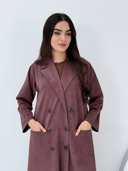 Woman wearing a Premium maroon burgundy Shamwa coat abaya against a white background