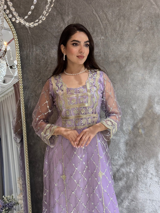 Woman in a luxury lavender Embroidered Tulle kaftan Dress with Stone Detailing standing on a marble floor