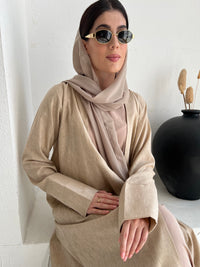 A woman wearing a Light Brown Linen Abaya with inner dress and a matching Sheila