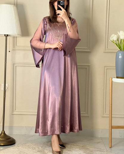 A woman wearing a Dusty Purple Satin Embellished Dress