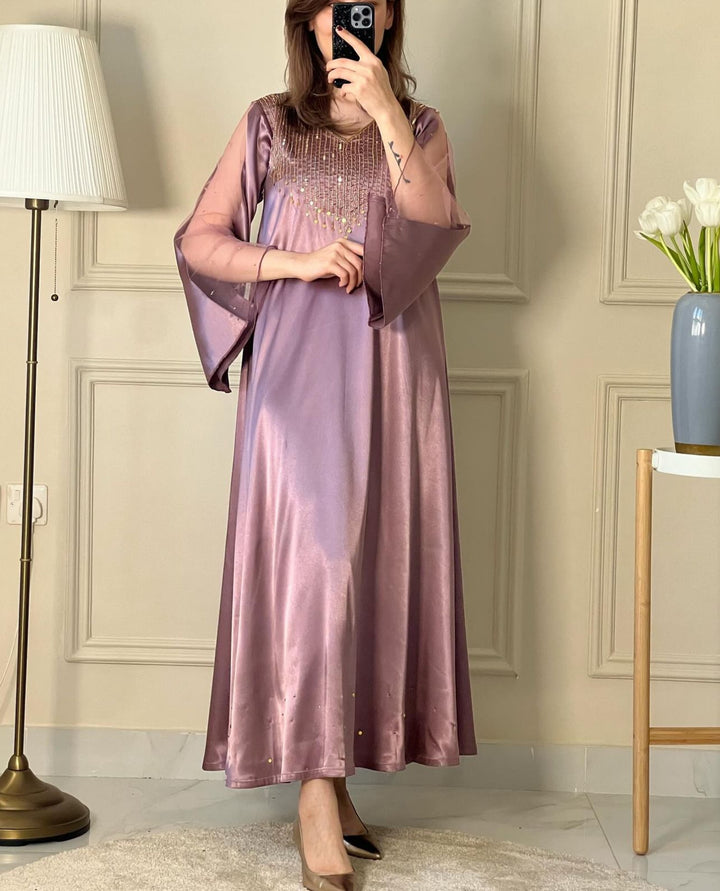 A woman wearing a Dusty Purple Satin Embellished Dress
