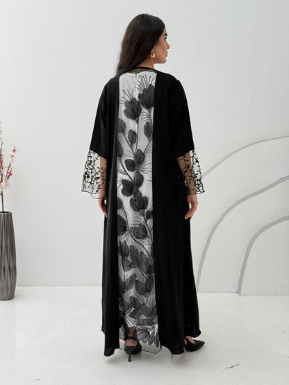 Woman wearing a Black Floral Lace Panel Abaya with a matching sheila against a white background