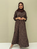 A woman wearing a chocolate brown abaya with a jacquard fabric, including a matching sheila headscarf, standing against a beige background.