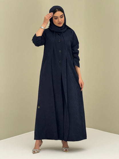 A woman wearing a Navy Blue Ice Cool Coat style with round neck and panel details Button-front, vertical bodice seams, buttoned cuff tabs