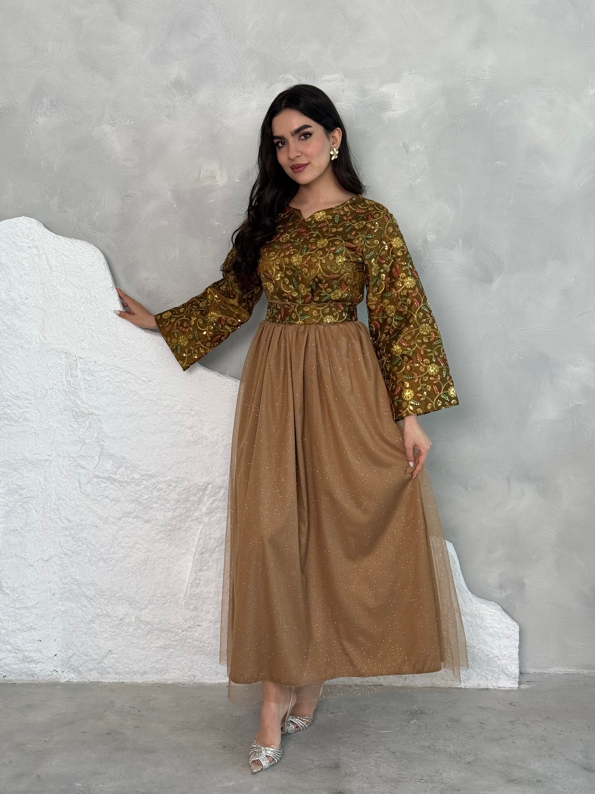 A woman wearing a floral long-sleeve  Brown Embroidered Tulle Dress