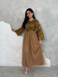 A woman wearing a floral long-sleeve  Brown Embroidered Tulle Dress