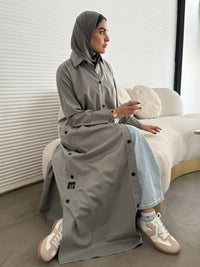 A light grey pinstripe abaya, a linen fabric, perfect for office wear and weekend outings.