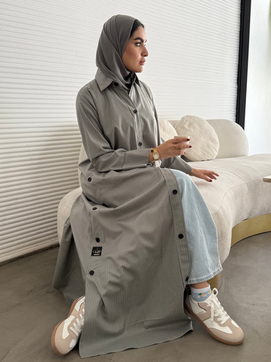 A light grey pinstripe abaya, a linen fabric, perfect for office wear and weekend outings.