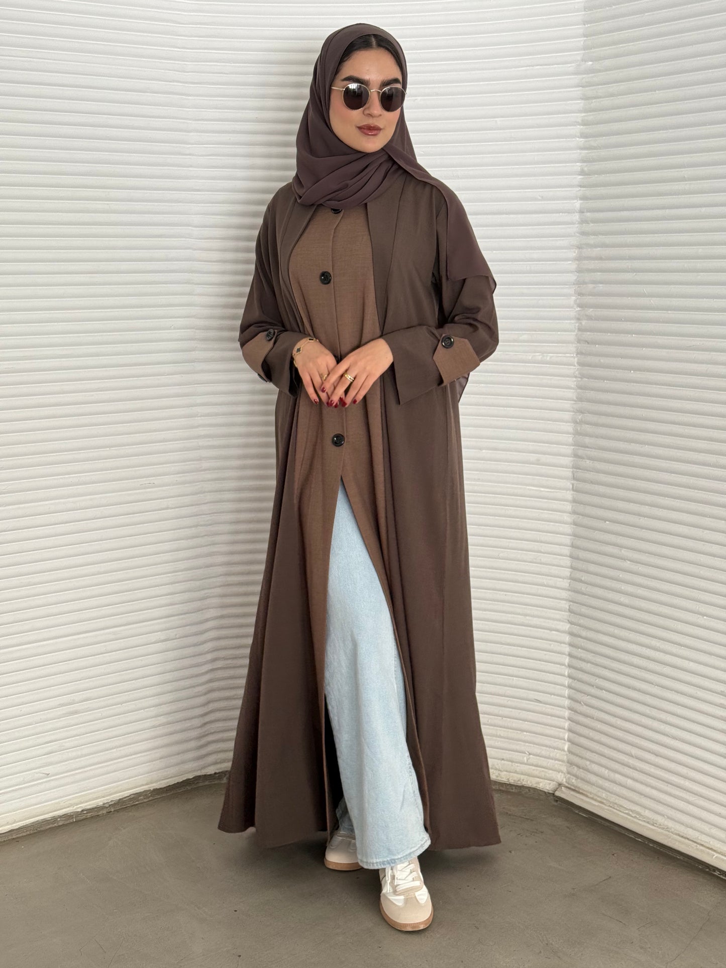 A dark brown and chocolate two-tone coat-style abaya, a premium linen abaya, perfect for travel and office wear.