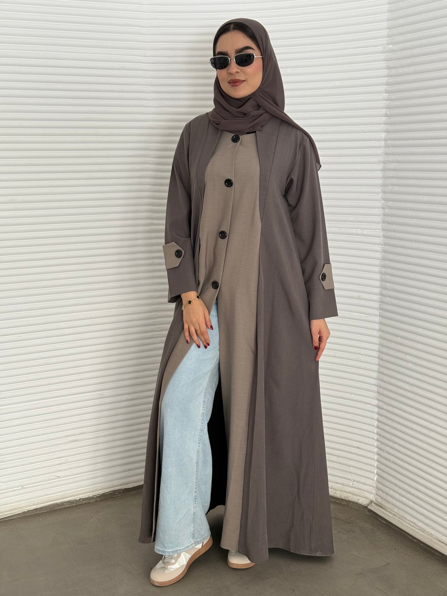 A taupe and beige two-tone coat-style abaya, a premium linen abaya, perfect for travel and office wear.