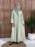 A black coat-style abaya is good for the office, boardroom, or an evening dinner and travel.