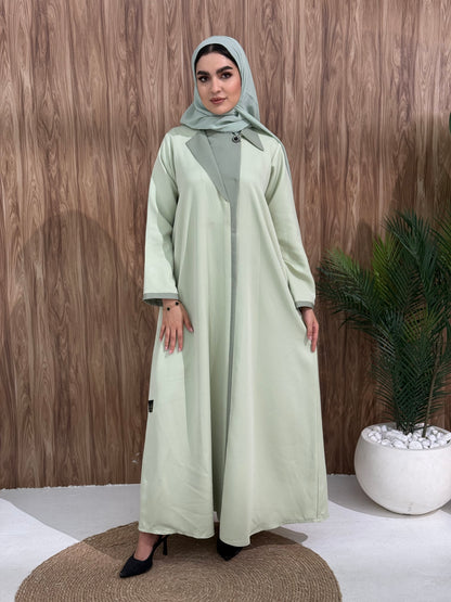 A black coat-style abaya is good for the office, boardroom, or an evening dinner and travel.