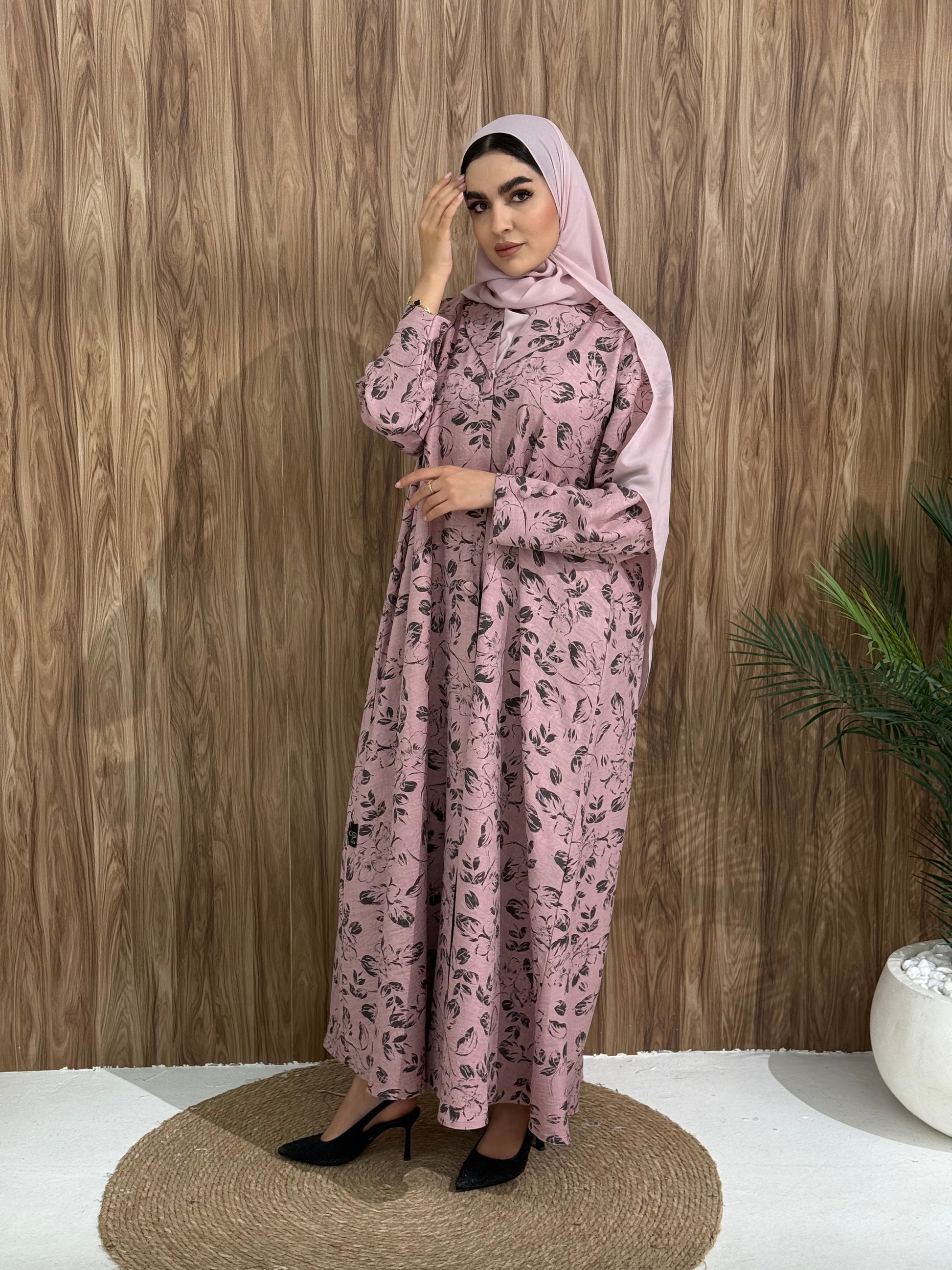 A dusty pink floral abaya that is perfect for office, evening wear, and events.