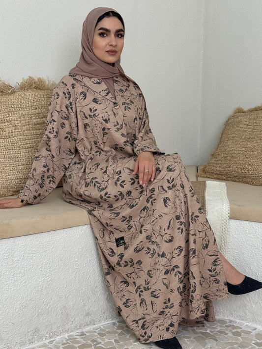 A light brown floral abaya that is perfect for office, evening wear, and events.