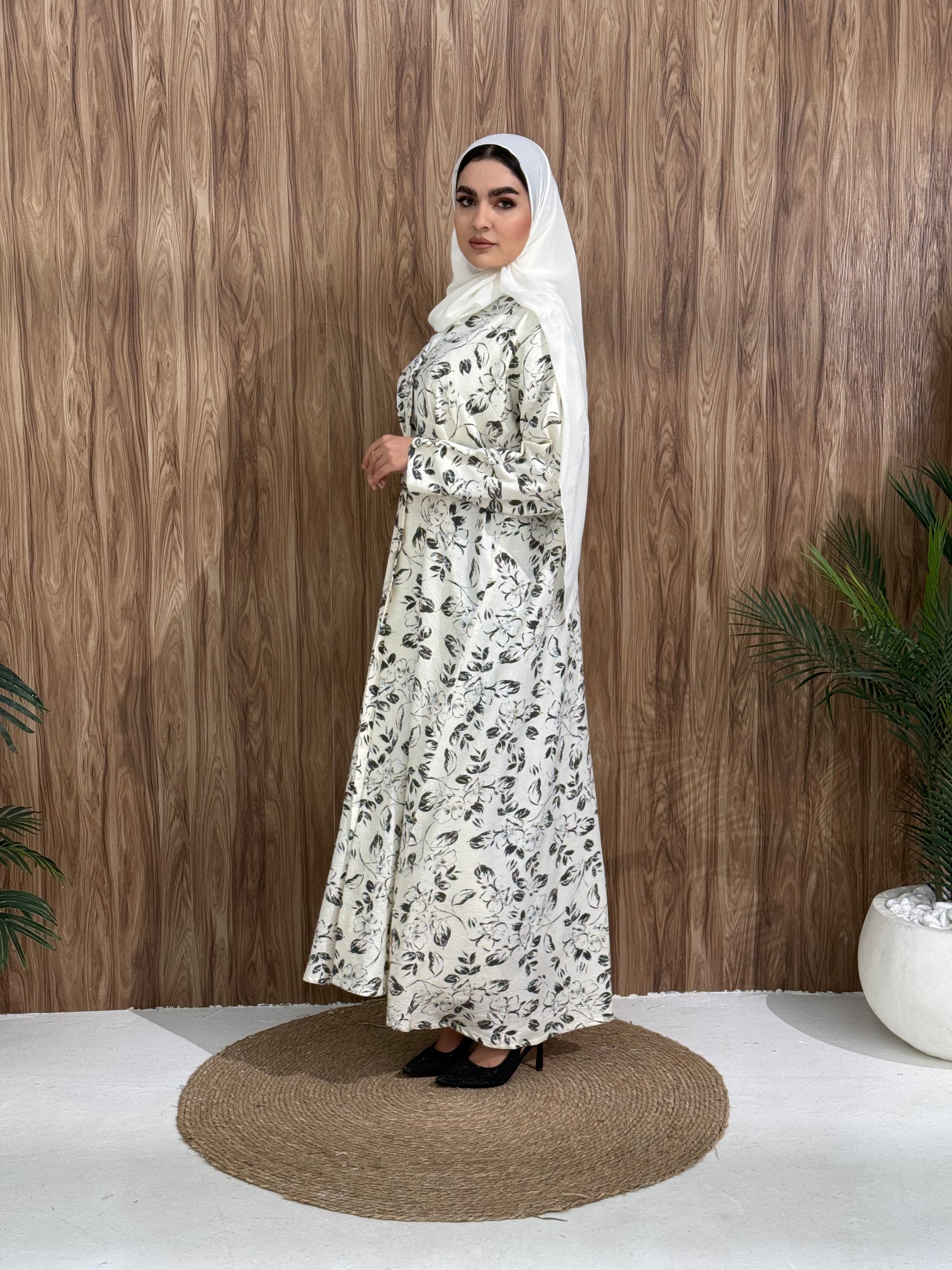 A white & black floral abaya that is perfect for office, evening wear, and events.
