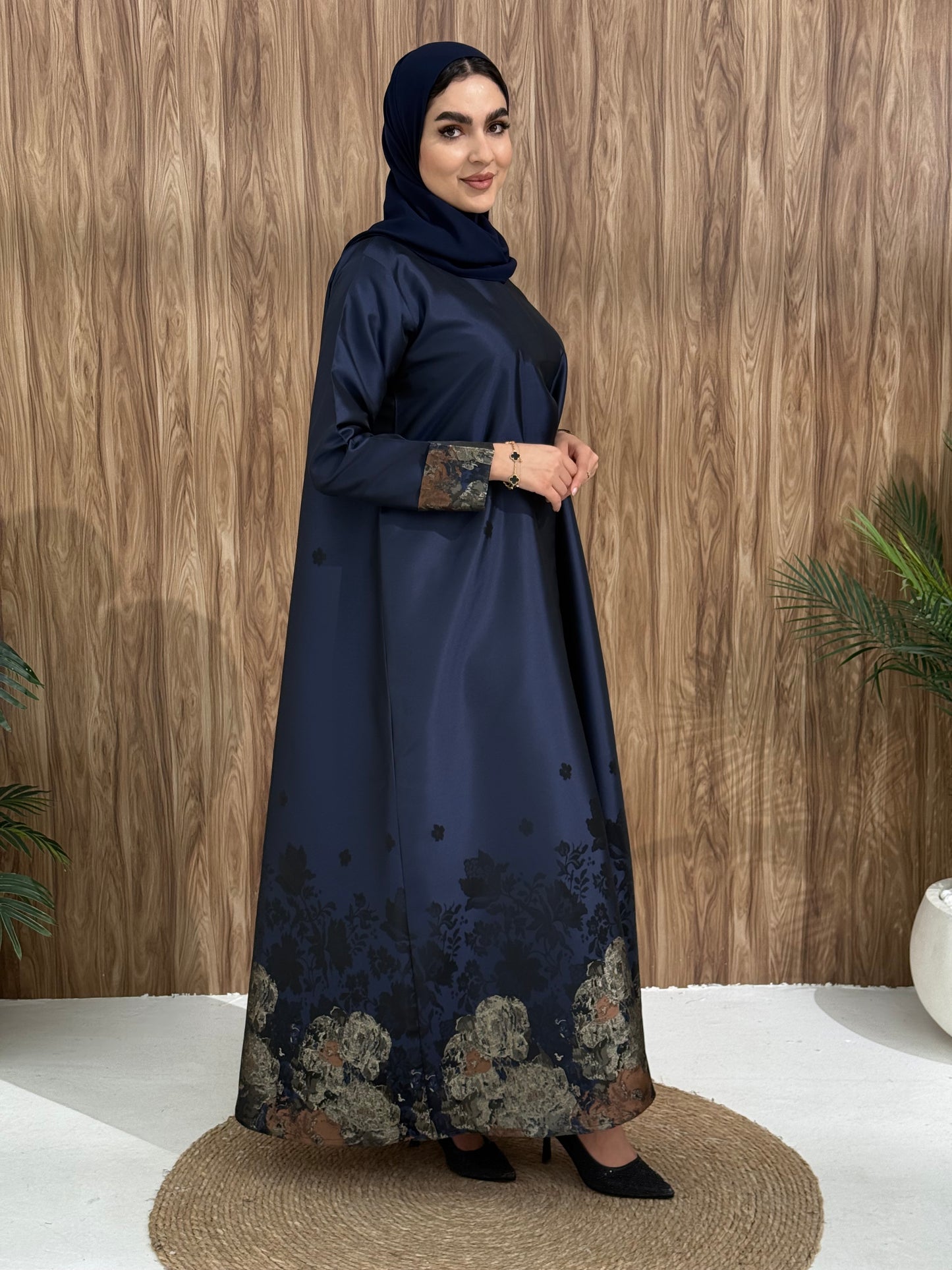 A royal blue floral satin abaya, with a unique look, perfect for events and occasions.