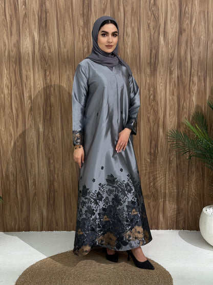 A silver grey floral satin abaya, with a unique look, perfect for events, and occasions.
