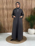 A layered grey abaya of a linen fabric hat is perfectly suited for daytime meetings or casual outings and travel.