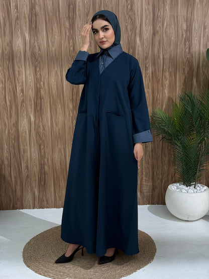 A layered navy blue abaya of a linen fabric hat is perfectly suited for daytime meetings or casual outings and travel.