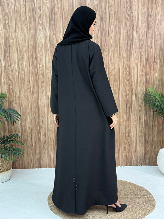 A black abaya designed with a structured blazer/coat style, this abaya is perfect for everyday office wear and casual events.
