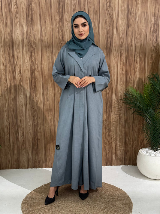 A grey blue abaya designed with a structured blazer/coat style, this abaya is perfect for everyday office wear and casual events.