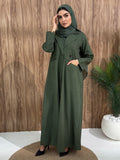 An olive green abaya designed with a structured blazer/coat style, this abaya is perfect for everyday office wear and casual events.