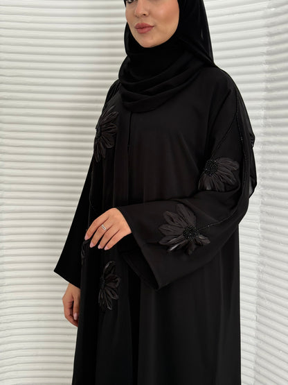 A black abaya, created /designed with a premium Nida fabric perfect for evening events.