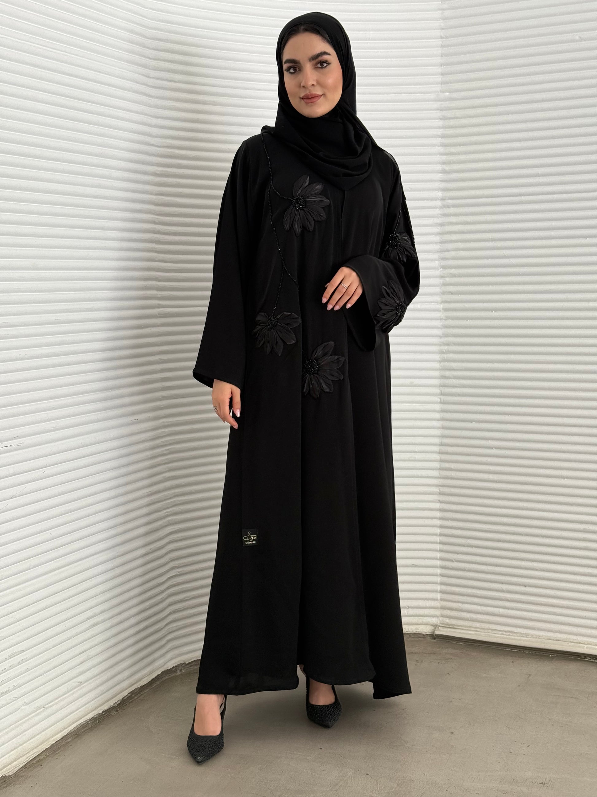 A black abaya, created /designed with a premium Nida fabric perfect for evening events.