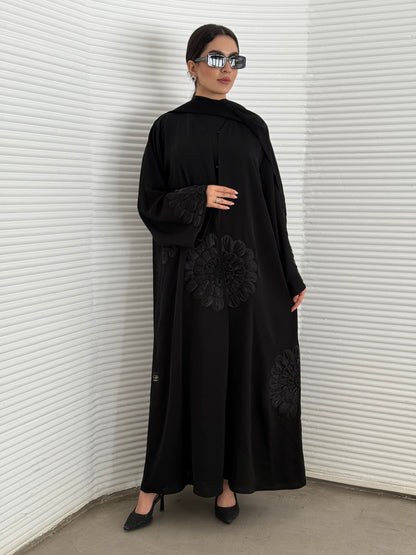 A premium nida fabric abaya, a black abaya that is elegant piece which offers effortless style, perfect for evening events and any occasion.
