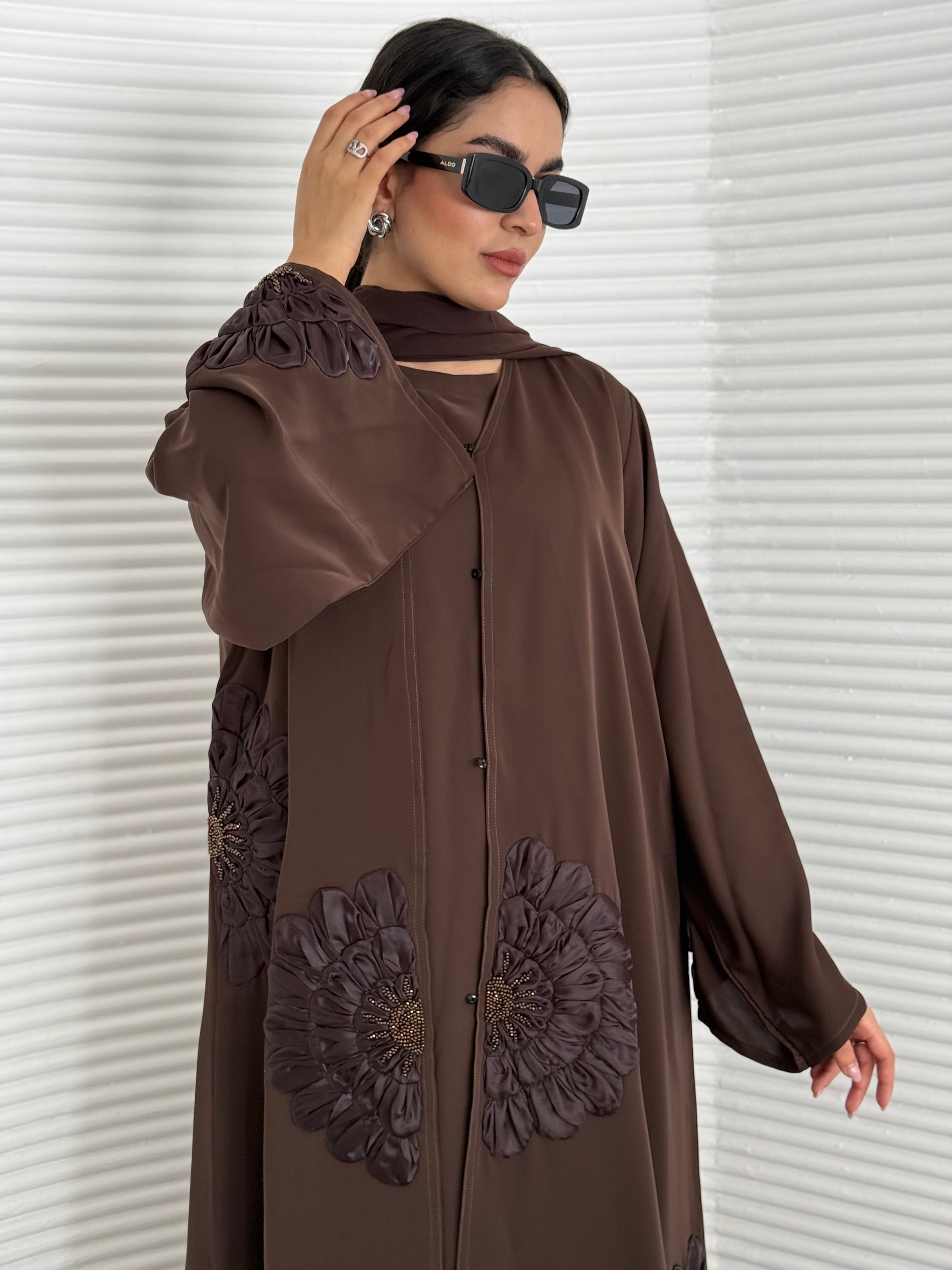A premium nida fabric abaya, a chocolate brown abaya that is elegant piece which offers effortless style, perfect for evening events and any occasion.