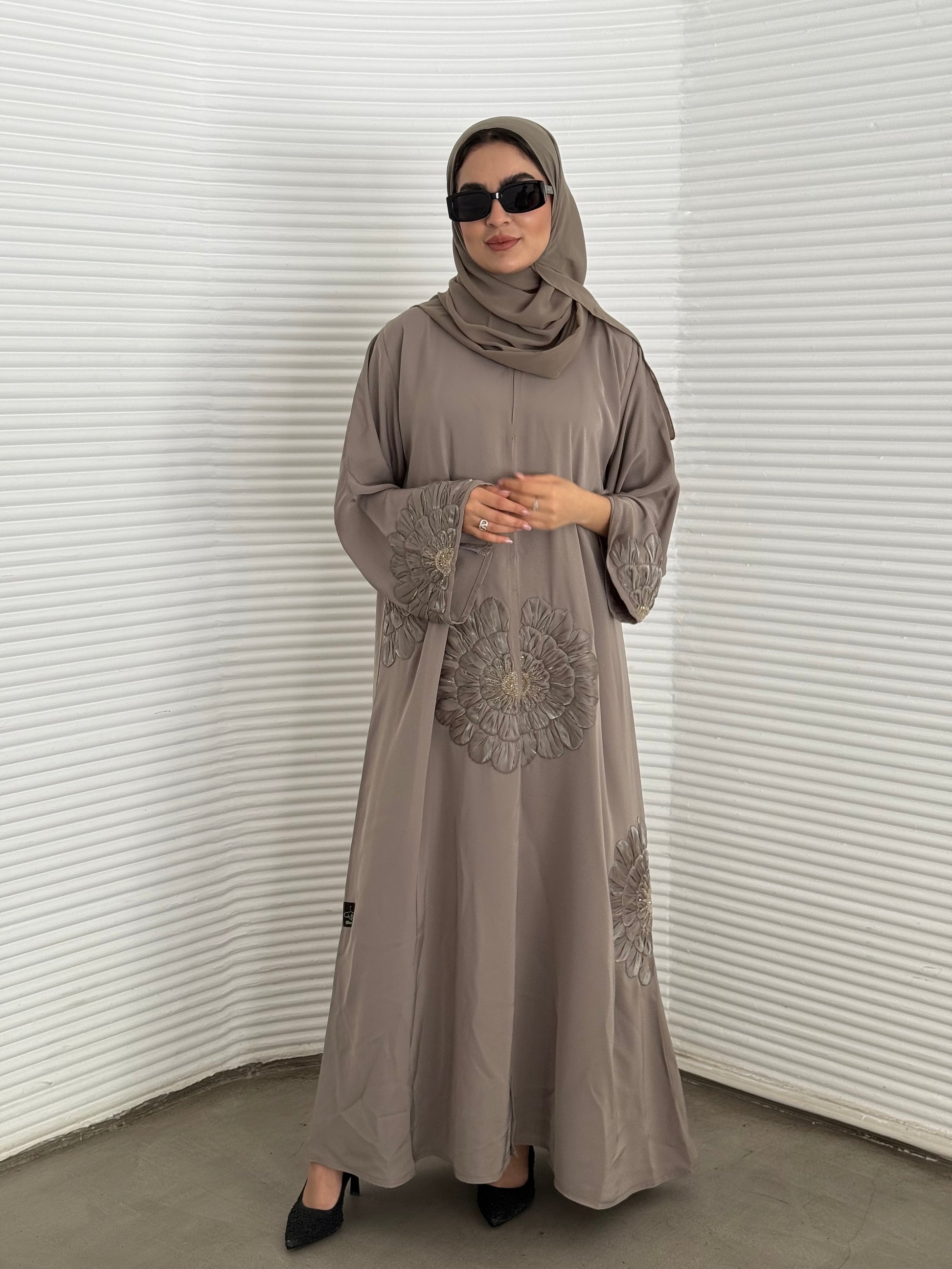 A premium nida fabric abaya, a light brown abaya that is elegant piece which offers effortless style, perfect for evening events and any occasion.