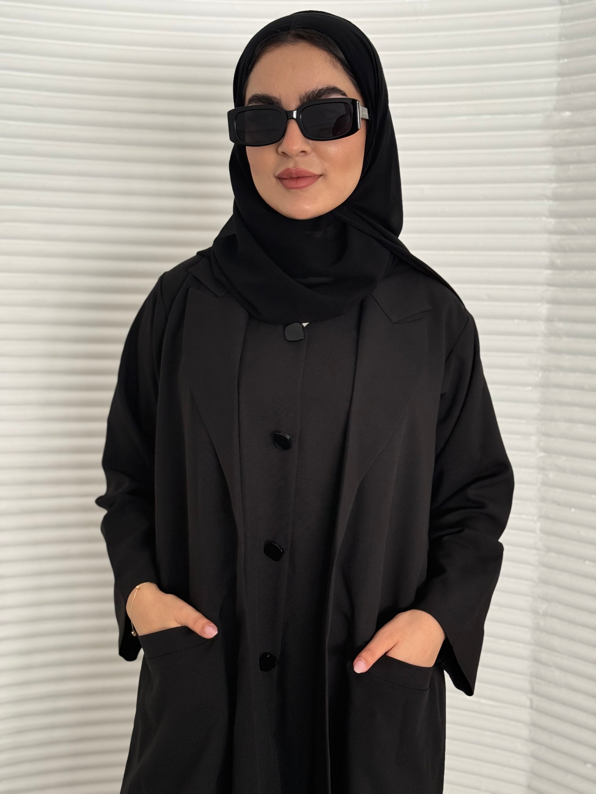 A premium linen black abaya with a matching sheila, perfect for formal occasions and travel.