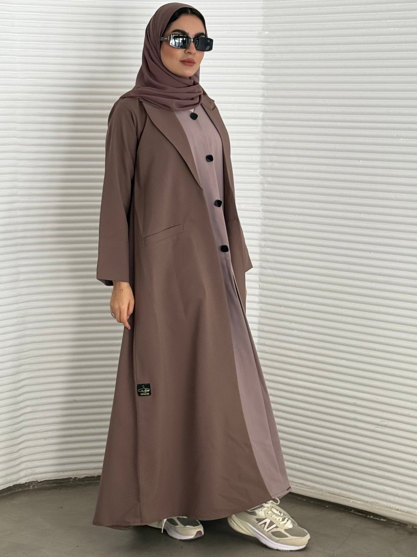 A premium linen mushroom brown  abaya with a matching sheila, perfect for formal occasions and travel.