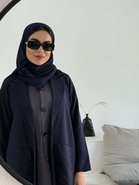 A premium linen navy blue abaya with a matching sheila, perfect for formal occasions and travel.