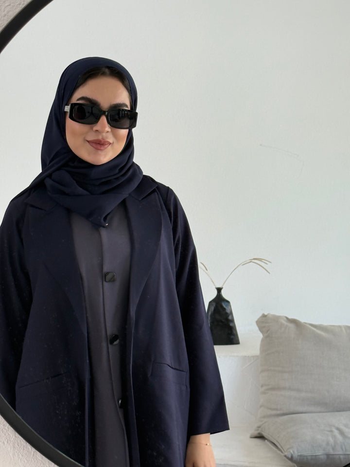 A premium linen navy blue abaya with a matching sheila, perfect for formal occasions and travel.