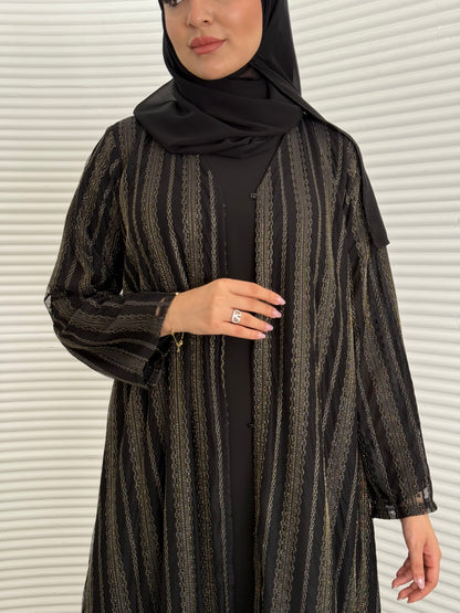 A 3 set of black and gold abaya, that includes a matching inner dress and sheila, this set is perfect for effortless evening luxury.