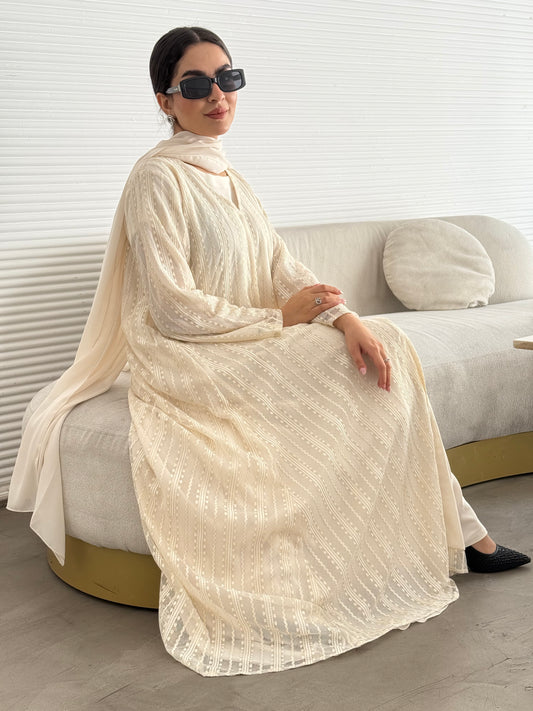 A 3 set of cream abaya, that includes a matching inner dress and sheila, this set is perfect for effortless evening luxury.