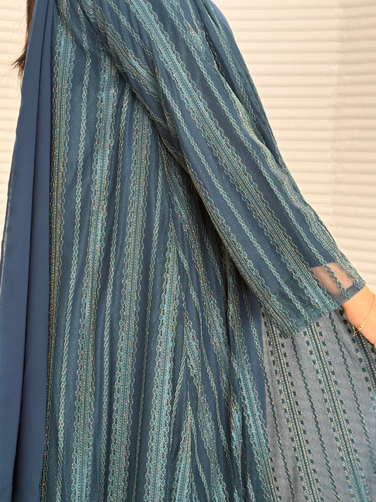 A 3 set of teal blue abaya, that includes a matching inner dress and sheila, this set is perfect for effortless evening luxury.