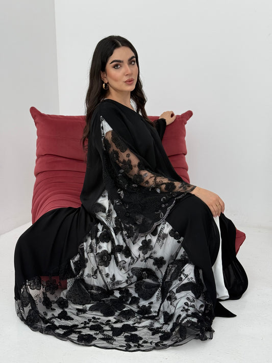 A black abaya, made of premium dantel (lace) and nida fabric, this abaya is perfect for Eid and parties.