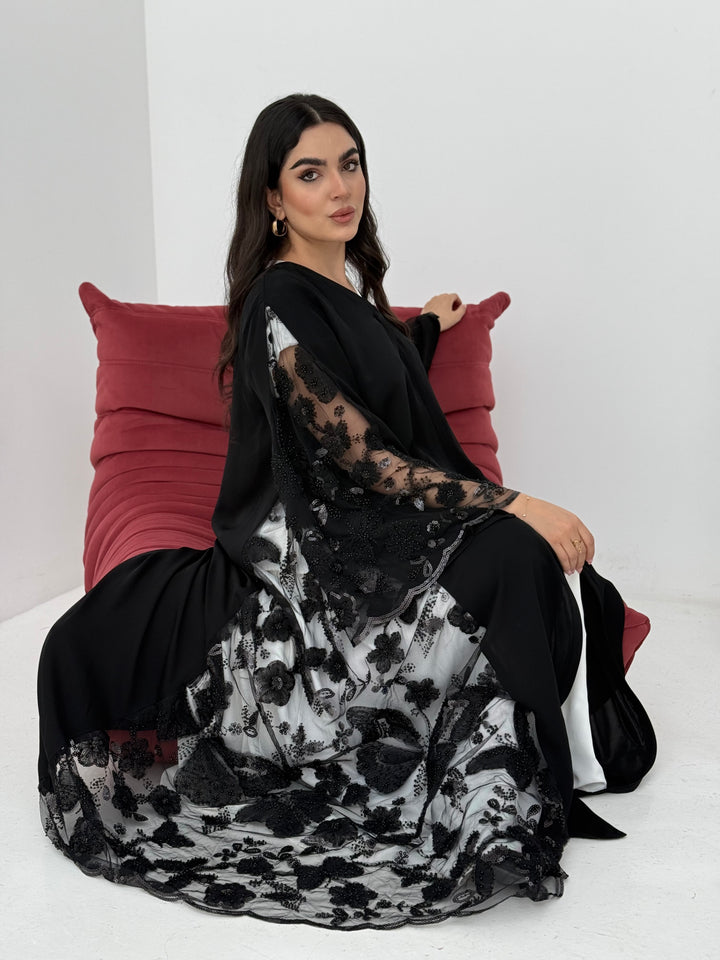 A black abaya, made of premium dantel (lace) and nida fabric, this abaya is perfect for Eid and parties.