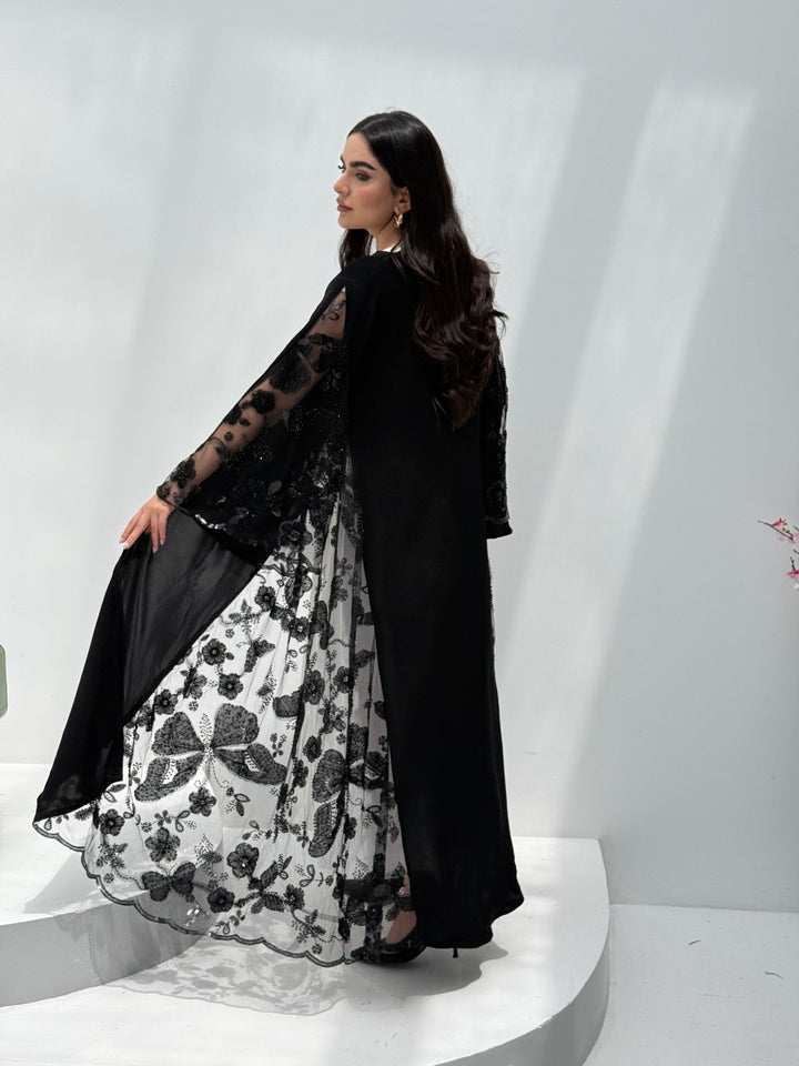 A back abaya, made of premium dantel (lace) and nida fabric, this abaya is perfect for Eid and parties.